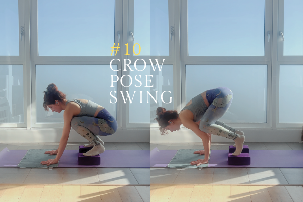 Yoga teacher rocks forward and back in crow pose with blocks under her feet.