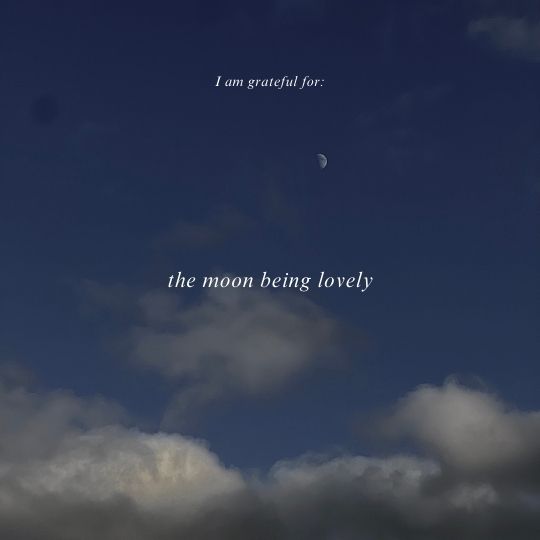 The moon and clouds in the sky. The text on the photo says: I am grateful for the moon being lovely.