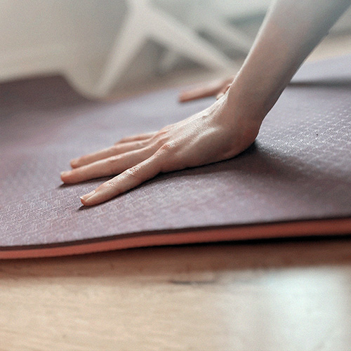 Hands on yoga mat