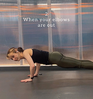 An incorrect body position in chaturanga dandasana because the elbows are reaching out